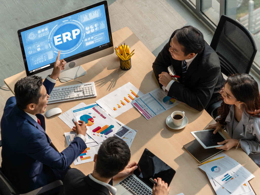 People collaborating around a business dashboard